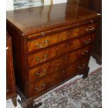 A 19th Century mahogany bachelors chest with four graduated drawers brushing slide over four