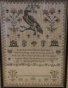 An early 19th Century sampler by Jane Arnolds aged 12 dated Nov 18 1836 worked with dove and floral