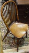 A set of five Ash and Elm stick back dining chairs on turned legs united by crinoline stretchers