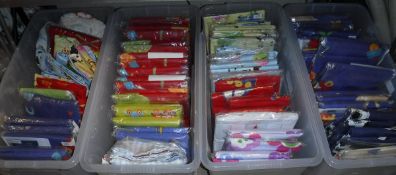 Four crates containing various children's duvet and cot sets, curtains, etc,