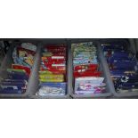 Four crates containing various children's duvet and cot sets, curtains, etc,