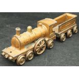 A gold-painted cast iron toy / floor train inscribed "Wallwork's Patent", No'd.