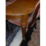A late Victorian walnut D-end dining table of small proportions,