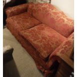 A 20th Century upholstered three seat sofa, in the George III style,