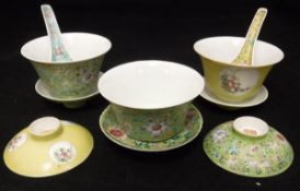 A collection of Chinese polychrome decorated rice bowls and spoons,