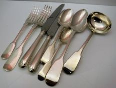 A Victorian silver twelve place set of cutlery comprising table spoons, table forks, dessert spoons,