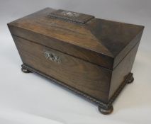 A 19th Century rosewood tea caddy of sarcophagus form,