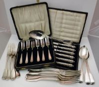 A set of four Victorian silver "Fiddle and Thread" pattern table forks (by William Eaton,