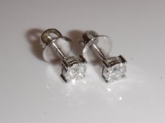 A pair of 9 carat white gold diamond set ear studs, approx 0.25 carats, approx 1.