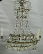 A 20th Century brass and cut glass six branch electrolier with central lights,