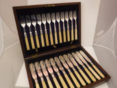 A cased set of twelve late Victorian silver-bladed and pronged fish knives and forks with engraved