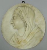 An 18th Century Italian carved marble relief plaque of oval form depicting a head and shoulders