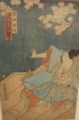 IN THE MANNER OF UTAGAWA KUNISADE "Figure in blue robes beneath cherry blossom tree,