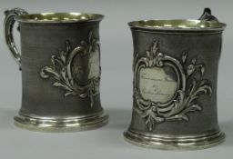 A pair of early Victorian silver tankards with scroll handle,