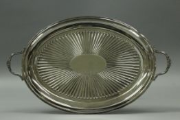A Victorian silver twin-handled oval drinks tray with central fluted fan medallion (by Roberts &