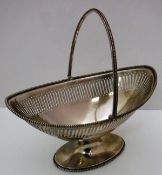A Victorian swing-handled oval basket with pierced decoration,