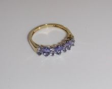 A 9 carat gold and tanzanite eleven stone dress ring,