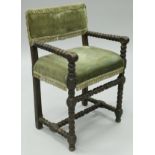 A late 16th Century (1550-1600) bobbin-turned walnut framed carver chair with green tasselled