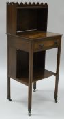 A 19th Century mahogany side table with three quarter galleried swivel top above the inlaid and