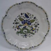An 18th Century Italian Bassano (Nove) faience plate of moulded form,