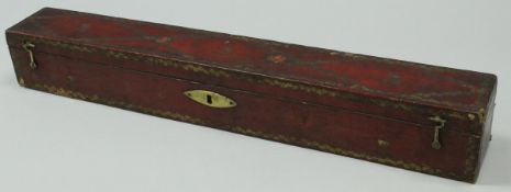 A Georgian embossed red leather and gilt decorated scroll box with gilded decoration and Royal