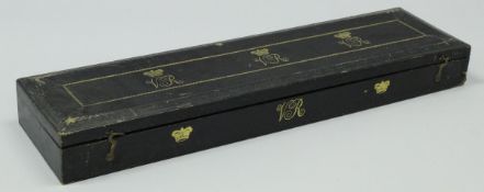 A Victorian embossed black leather clad and gilt decorated scroll box with gilt decorated blue