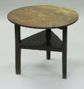 A late George III oak cricket table,