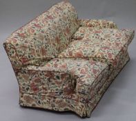 A 20th Century three seat sofa in the Howard manner,