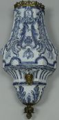 An 18th Century Dutch Delft wall cistern or fountain, with applied gilt metal mounts,