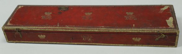 A William IV embossed red leather clad and gilt decorated scroll box with gilt and blue paper lined
