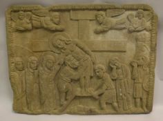A carved natural stone tablet depicting the deposition of Christ with Joseph of Arimathea and