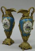 WITHDRAWN A pair of 19th Century Sèvres type gilt bronze mounted ewers,