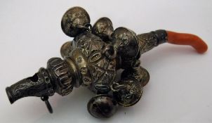 A Victorian silver rattle/teether with embossed and engraved decoration bells and coral teether (by