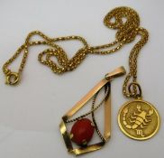A 14 carat gold chain with a yellow metal pendant of circular form for Scorpio,