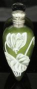 A late Victorian cameo glass scent bottle of green colour decorated with white enamel flowers in