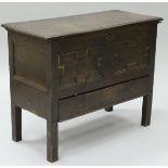 A 17th Century oak mule chest,