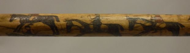 A 19th Century wooden walking stick with hand-painted and incised decoration of a busy hunt with