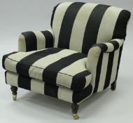 A 20th Century armchair in the Howard manner with black and grey striped upholstery,