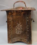 A circa 1900 Arts & Crafts style beaten and studded copper coal box IN THE MANNER OF CHARLES VOYSEY,