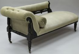 A Victorian ebonised framed chaise longue in the Aesthetic taste,