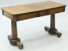 A 19th Century rosewood library table the plain top with rounded corners above the two frieze