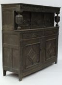 A 17th Century oak court cupboard,