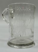 A rare 18th Century glass mug with plain loop handle with engraved depiction of a figure with cane