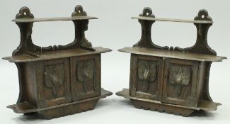 A pair of Victorian carved oak wall cabinets in the Black Forest taste,