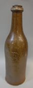 A rare circa 1800 salt-glazed stoneware bottle of wine bottle form, inscribed with initial "R", 28.