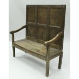 A late 18th Century oak settle,