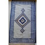 A Kelim rug, the central panel set with lozenge shaped medallion on a mushroom ground,