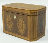 A Regency mahogany and marquetry inlaid two section tea caddy with conch shell decoration to the