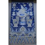 A Chinese rug, the blue ground decorated with Dog of Fo and tigers,