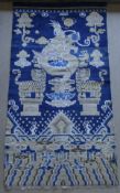 A Chinese rug, the blue ground decorated with Dog of Fo and tigers,